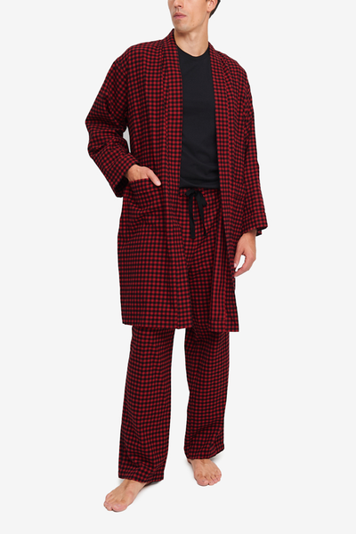 Men's robe in red and black buffalo check cotton flannel. Features two patch pockets, shawl collar and matching belt.