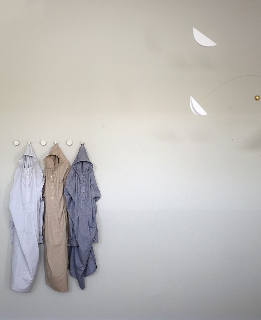 Long Sleep Shirt's hanging on hooks. Part of the AMM x The Sleep Shirt Collab