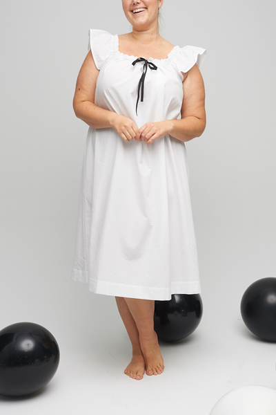 Both a nightie and a cocktail dress, The Party Nightie falls below the knee with a flared silhouette. A gathered neckline make the fit just right. 