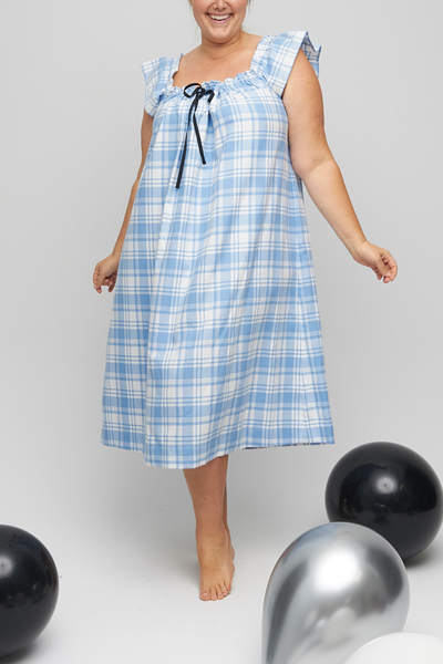 The Party nightie is a gorgeous, comfortable nightdress that can be worn as a cocktail dress. Gathered neckline with a grosgrain ribbon, made from a cream and blue flannel cotton. 