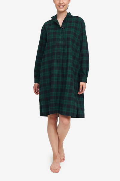 Long nightshirt with high collar and long sleeves. Made in a luxurious dark black and green check cotton flannel. Hem will hit below the knee.