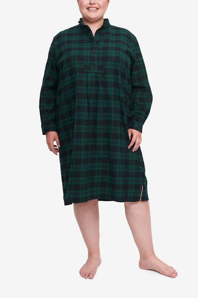 Plus size long nightshirt with high collar and long sleeves. Made in a luxurious dark black and green check cotton flannel. Hem will hit below the knee.