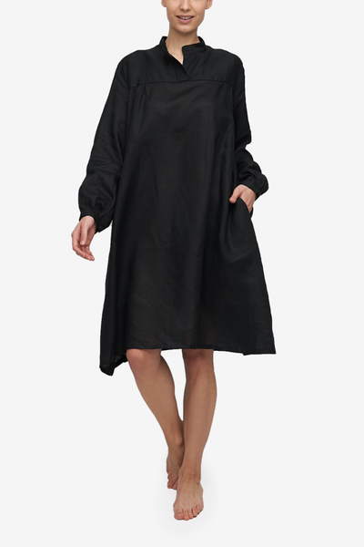 Knee-length black linen Sleep Shirt, with a billowy bishop sleeve and a flared silhouette. And pockets!