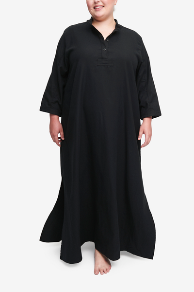 Plus size floor length chemise in black cotton flannel with three quarters sleeves and placket. Slips on easily, modest sleepwear.