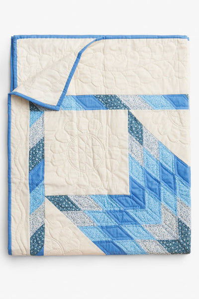 folded blue and cream star pattern amish wholecloth cotton blanket quilt handmade in USA by the Sleep Shirt