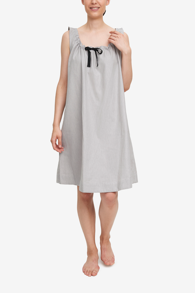 From one of Canada's best sleepwear brands, theis sleeveless nightgown has a gathered neckline and flared silhouette. Made in a light grey cotton shirting.