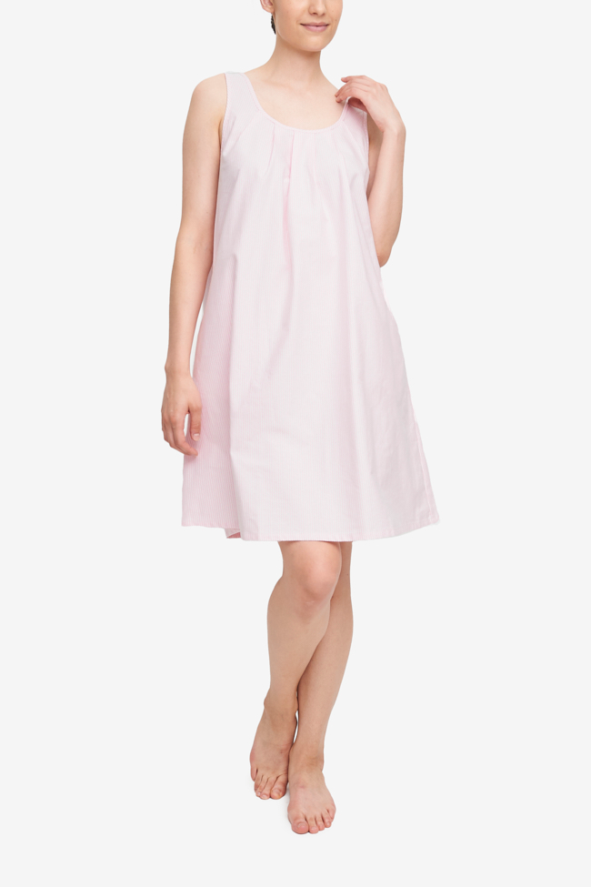 A-line nightgown with pockets. Made from high-quality pink and white striped cotton, sleeveless and pretty pleating at the neck.