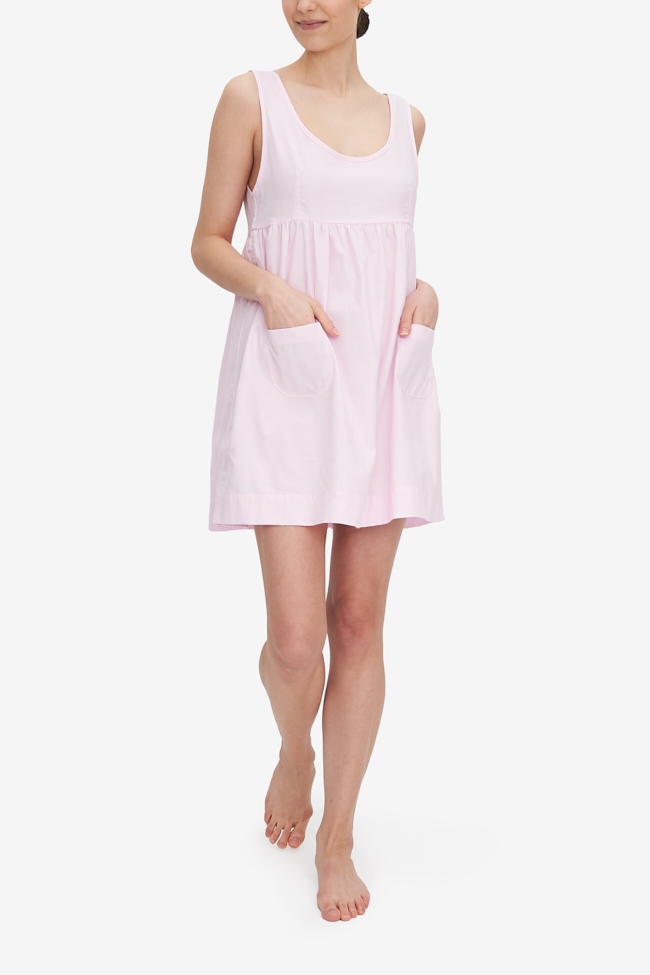 The Pocket nightie, shown here in Pink Royal Oxford cotton shirting, has a high empire waist, a tank-style bodice and a gathered skirt with two patch pocket on the front. It's on the shorter side, hitting most about mid-thigh.