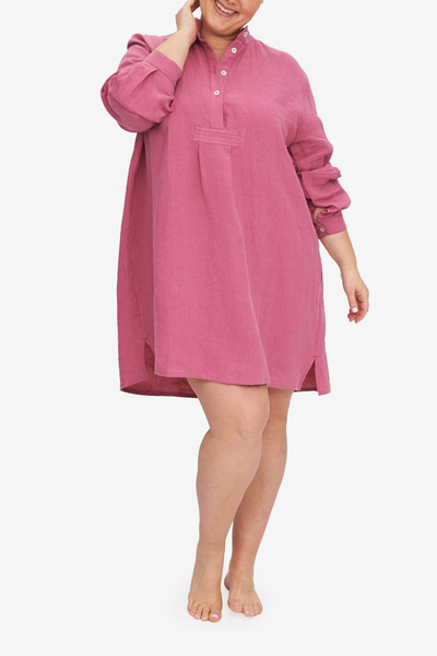 Charlotte wears the Short Sleep Shirt in Plus. This version is made in a bouncy, soft linen in a deep rose pink colour.