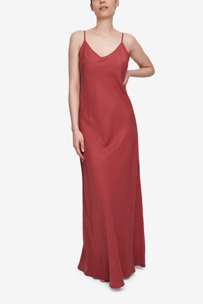 A deep, earthy orange coloured slip dress, floor length. Spaghetti straps, adjustable for the best fit. Floor length.