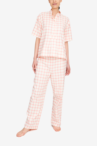 Traditional pj set of a short sleeve, over the head shirt and matching pyjama pants. This cream and pink flannel is fun and sophisticated at the same time.