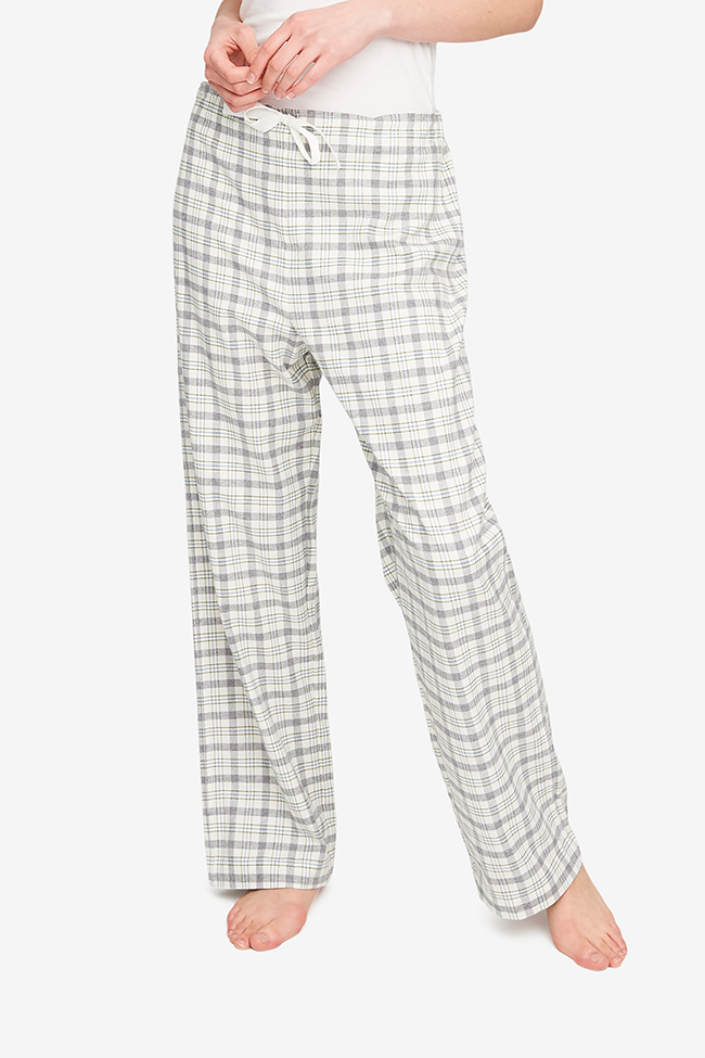 Basic pajama pant style with a drawstring front waist and an elastic back waist to make the best fit possible. Made from a flannel in cream, grey and green.