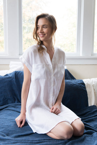  knee length button down tshirt with pockets in white linen on model by the Sleep Shirt